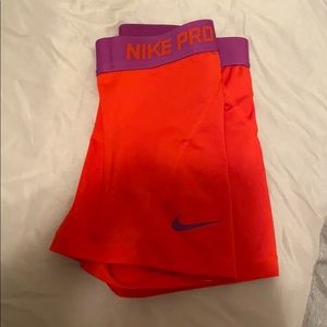 Red and purple Nike shorts